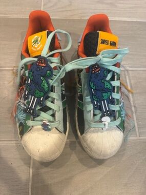 Adida super earth sneakers with strings and shoe charms